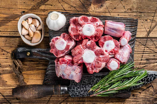 Raw-beef-Oxtail-cut-Meat-on-wooden-cutting-board-with-knife